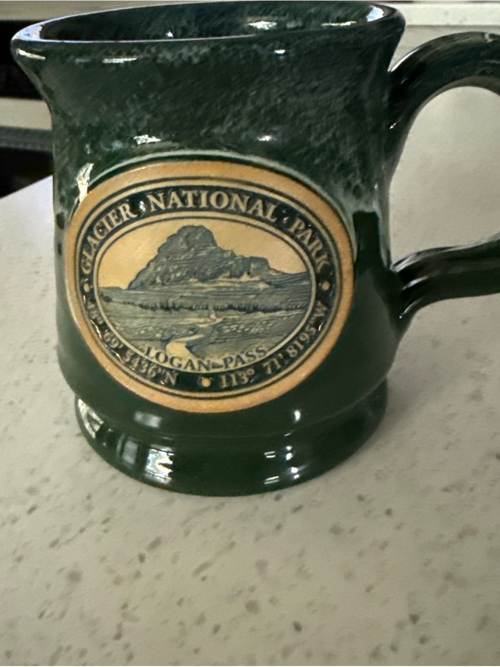 Deneen Pottery Glacier National Park Green Ceramic Mug with Logan Pass Emblem